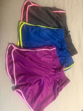 Danskin Now Women's Athletic Shorts Trio in Purple, Blue, and Black